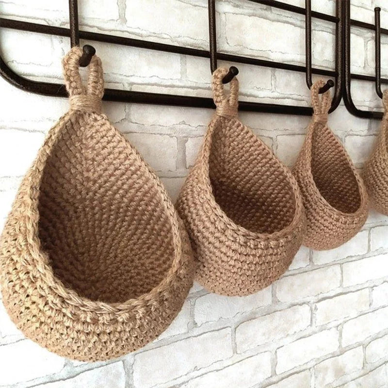 Wall-mounted wicker baskets hanging from metal rail – natural decor