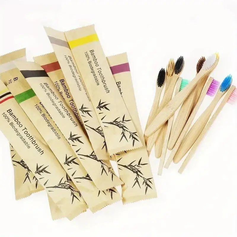 Biodegradable bamboo toothbrushes laid out in eco-friendly packaging