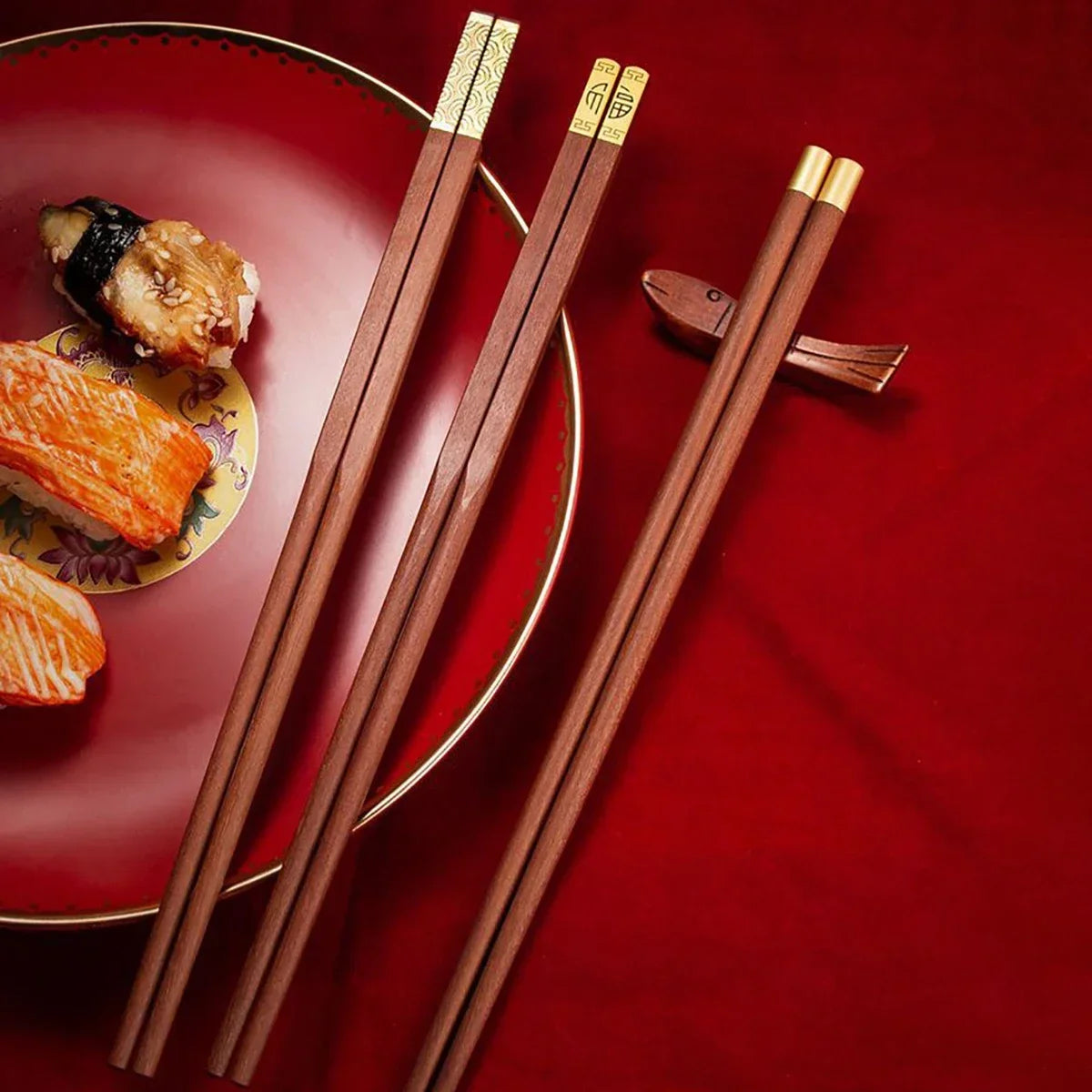 Elegant reusable chopsticks laid on red cloth