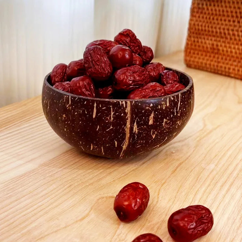 Wooden salad bowl made from reclaimed coconut shell – eco-lifestyle setting