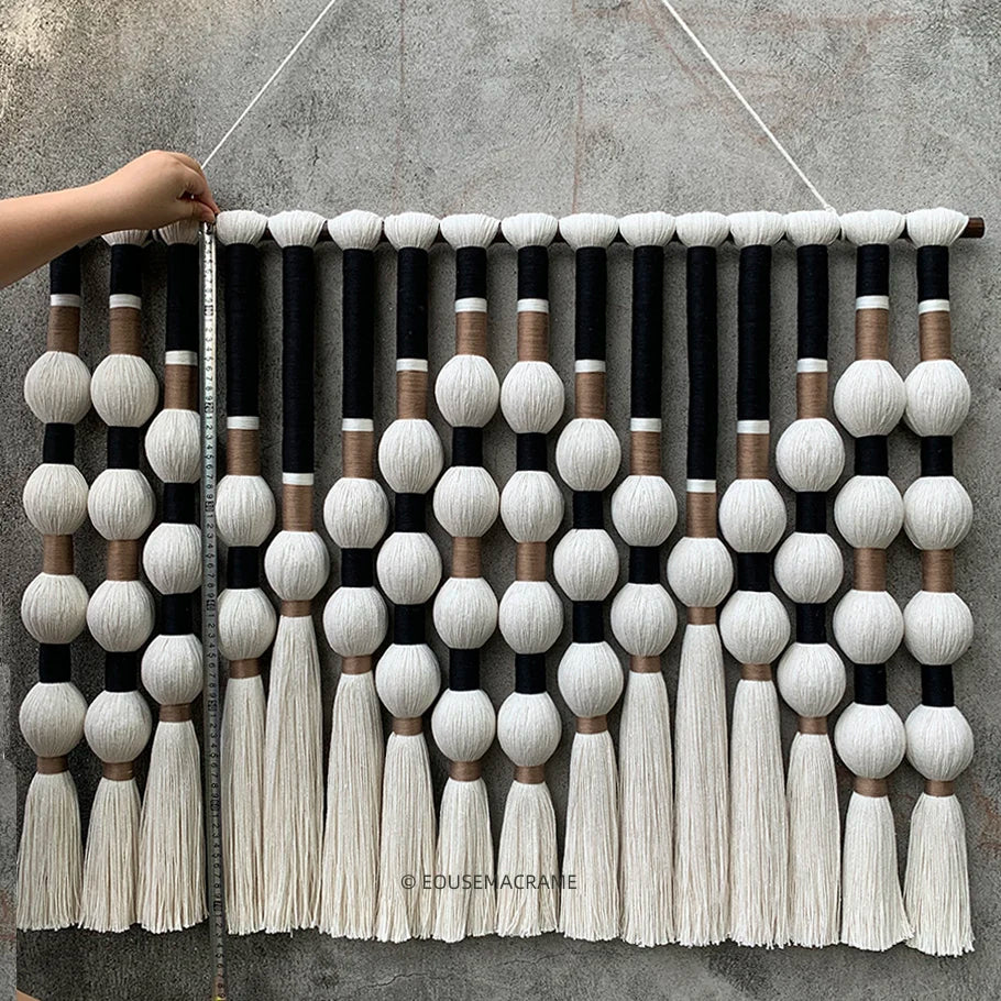 Close-up of boho macramé knots and wooden beads