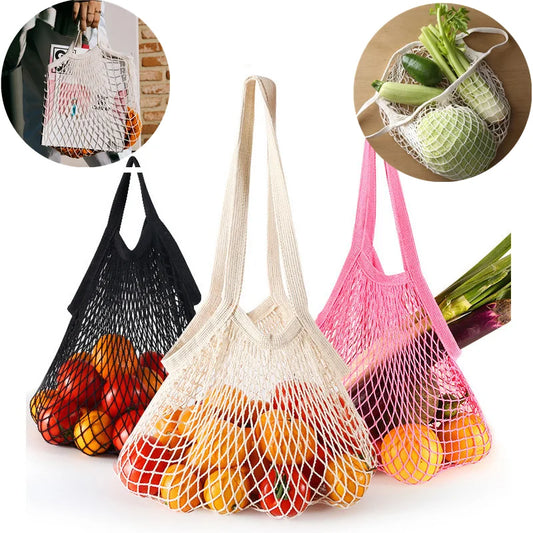 Reusable cotton mesh shopping bags in pink, white, and black with fruit