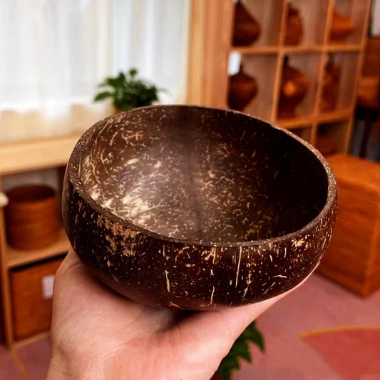 Wooden salad bowl made from reclaimed coconut shell – eco-lifestyle setting

